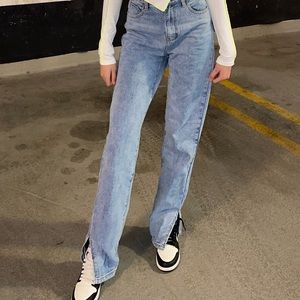 Light washed jeans with slit at the bottom of jeans